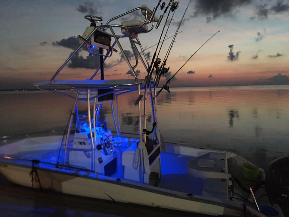 fishing charter boat at night with lights